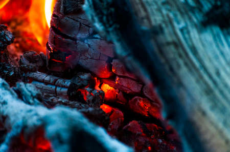 Hot fireplace with burning coals of firewood