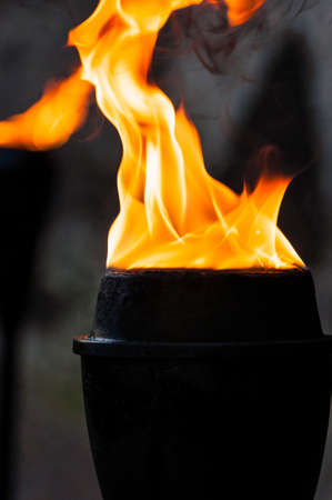 Oil flaming black metal torch. Medieval lighting equipment.の写真素材