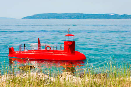 Bright red tourist submarine in Adriatic sea watersの写真素材