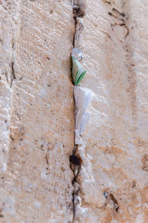 Western Wall is one of the major ancient Jewish relics. Each of us being near the wall can write down on paper their cherished dreams, desires and requests and shove them between the Wall plates.の写真素材