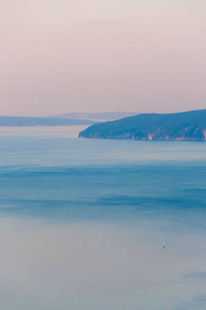 Direction to Cres Island. Sailing yacht at sunset in the Adriatic Sea. Amazing Istria, Croatia.の写真素材