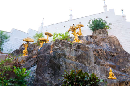 Murudeshwar, Karnataka, India: Golden sculptures of Vyasa the sage sitting and meditating on the rocks in different poses in Murudeshwar Temple complex.の写真素材