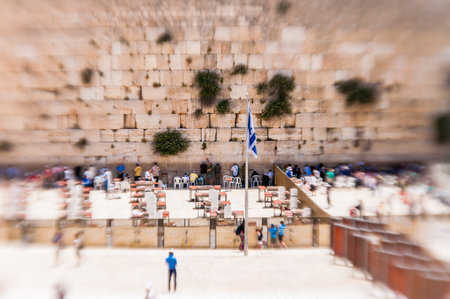 Jerusalem, Israel - May 25, 2012: Israel flag on flagpole in the middle of Western Wall square or plaza in Jerusalem Old Town, Israelのeditorial素材
