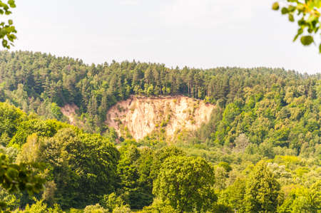 High sand cliff in the forest of Pavilniai National Parkの写真素材