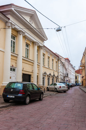 Vilnius, Lithuania - April 28, 2013: Cars parked on S. Skapo street in Old Town of Vilnius. Classical European architecture street designのeditorial素材
