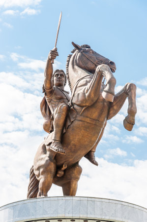 Skopje, Macedonia - June 10, 2013: A giant bronze statue of the ancient warrior king with sword on the horse that standing up on its hind legs. The statue of Alexander the Great at Macedonian Squareのeditorial素材