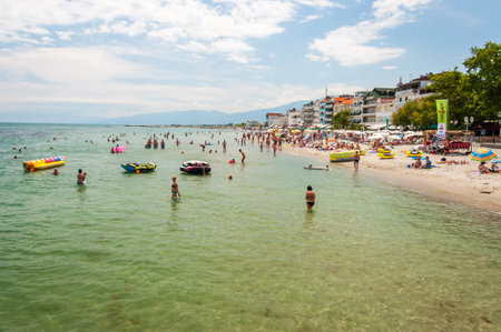 Paralia, Greece - June 13, 2013: Paralia resort city on Aegean sea coast full of hotels, apartments, beaches, tourists and various attractionsのeditorial素材