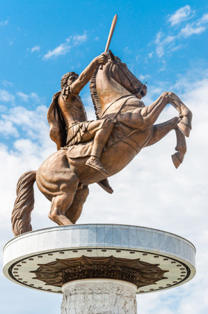Skopje, Macedonia - June 10, 2013: A giant bronze statue of the ancient warrior king with sword on the horse that standing up on its hind legs. The statue of Alexander the Great at Macedonian Squareのeditorial素材