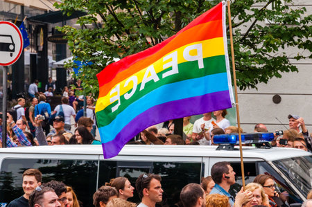 Vilnius, Lithuania - July 27, 2013: Pride parade in action. Famous rainbow peace flag above the crowd of demonstrators. Event celebrating lesbian, gay, bisexual, transgender, LGBTI culture prideのeditorial素材