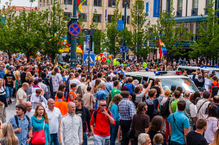 Vilnius, Lithuania - July 27, 2013: Pride parade in action. Crowd of watchers and demonstrators with rainbow flags. Event celebrating lesbian, gay, bisexual, transgender, LGBTI culture prideのeditorial素材