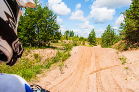 Vilnius, Lithuania - July 14, 2013: An amateur motorcyclists practice his manoeuvres with photographer sitting behind and making a shot of his track. This is an outdoors shot taken on public landの写真素材