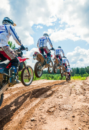 Vilnius, Lithuania - July 14, 2013: A group of amateur motorcyclists practice their manoeuvres. This is a multiple exposure shot taken on public landのeditorial素材