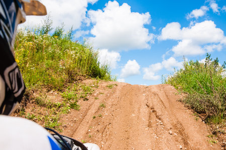 Vilnius, Lithuania - July 14, 2013: An amateur motorcyclists practice his manoeuvres with photographer sitting behind and making a shot of his track. This is an outdoors shot taken on public landのeditorial素材