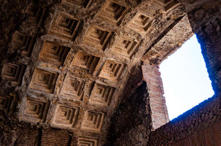 Ancient round cassette ceiling with natural sunlight penetrating through the window apertureの写真素材