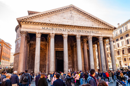 Rome, Italy - November 18, 2018: People walking on the square of the famous Pantheon temple of all the gods is a former Roman temple with bright sun rays illuminating from above behind the templeのeditorial素材