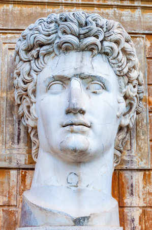 Vatican, Rome, Italy - November 16, 2018: Close-up of a big marble head bust statue of Julius Caesar in the Vatican Museum garden, Rome, Italy. Courtyard of the Pigna.のeditorial素材