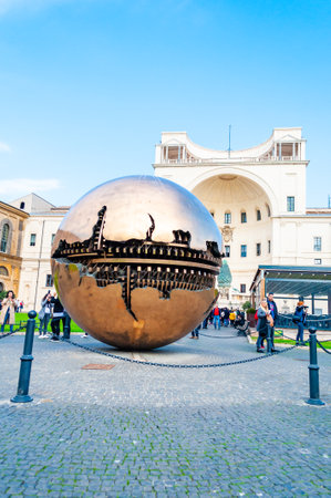 Vatican, Rome, Italy - November 16, 2018: Sphere Within Sphere Sfera con sfera is a bronze sculpture by Italian sculptor Arnaldo Pomodoro decorates a center of the Cortile della Pigna in Vaticanのeditorial素材