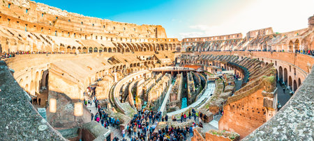 Rome, Italy - November 17, 2018: Wide panorama of Colosseum or Coliseum, also known as the Flavian Amphitheatre, is an oval amphitheatre in the center of the city of Rome full of peopleのeditorial素材