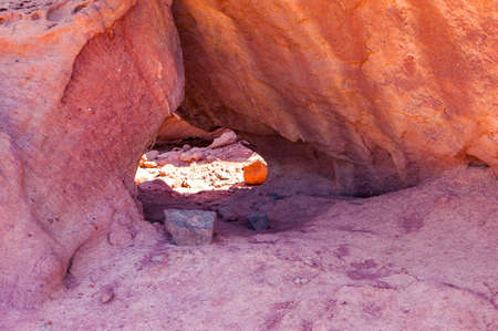Interesting shapes trails surrounded by caves, rocks, cliffs of ancient cooper mines canyons and mountains range in Timna National Park in Israelの写真素材