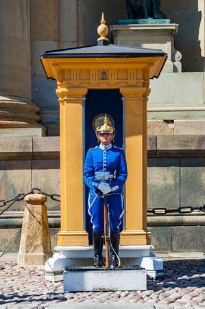 Stockholm, Sweden - May 26, 2017: Royal Palace Guard standing near his sentry box. The Royal Guard has had a presence at the palace since 1523, when it consisted of 100-200 soldiers.のeditorial素材