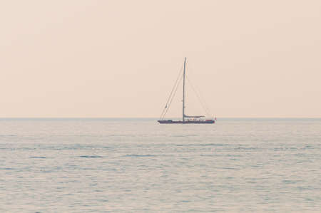 Sailing yacht in the Ligurian sea waters near the Italian Riviera Sanremo coastの写真素材