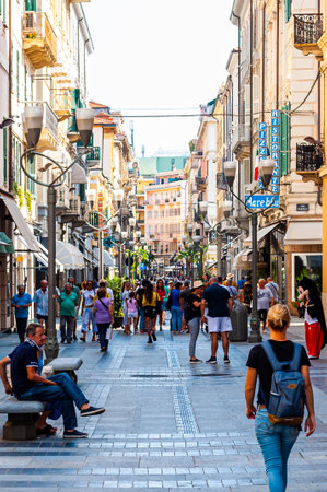 Sanremo, Italy - September 01, 2019: People walking by the ancient medieval Old Town street in Sanremo, Italy.のeditorial素材