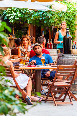 Monterosso Al Mare, Italy - September 02, 2019: People are sitting in restaurant and bars on the cozy streets in Monterosso Al Mare, Cinque Terre, Italyのeditorial素材
