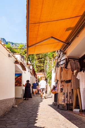 Positano, Italy - September 05, 2019: Amazing medieval Positano cityscape on rocky landscape, people and tourists walking by the cozy streets full of art galleries, shops and local businessesのeditorial素材