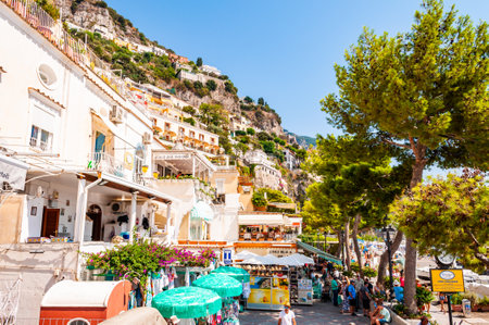 Positano, Italy - September 05, 2019: Amazing medieval Positano cityscape on rocky landscape, people and tourists walking by the cozy streets and beach promenades full of hotels, apartments businessesのeditorial素材