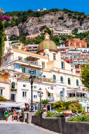 Positano, Italy - September 05, 2019: Amazing medieval Positano cityscape on rocky landscape, people and tourists walking by the cozy streets and beach promenades full of hotels, apartments businessesのeditorial素材