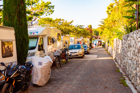 Camping La Ca, Garda Lake, Lombardy, Italy - September 12, 2019: Cozy inside landscape design of camping La Ca located on the southern shore of Garda lake. Area for tents, campers, bungalows, housesのeditorial素材