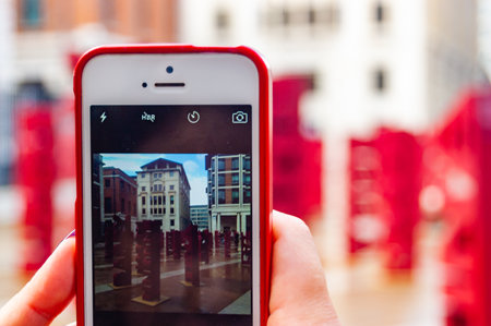 London, United Kingdom - September 18, 2017: The installation of 104 red names placed in London Paternoster Square as a part of Make Blood Cancer Visible campaign shoot on phone with red caseのeditorial素材