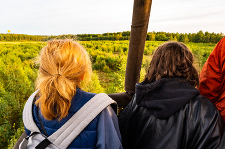 Vilnius, Lithuania - September 14, 2021: Passengers in the basket watching the landing process of hot air balloonのeditorial素材