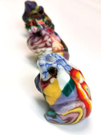 3 Frog shaped candles on white backgroundの写真素材