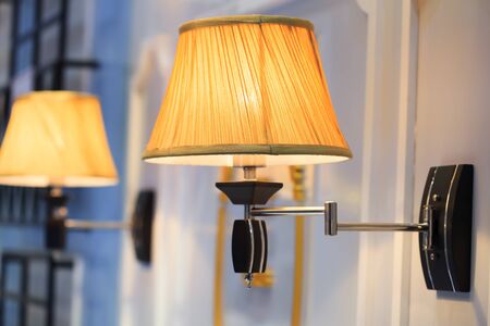 Wall lamp with yellow shadeの写真素材