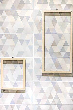 Two yellow wood picture frame on  plank wall for backgroundの写真素材