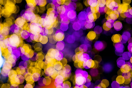 Abstract Yellow Purple lights bokeh backgroundの写真素材