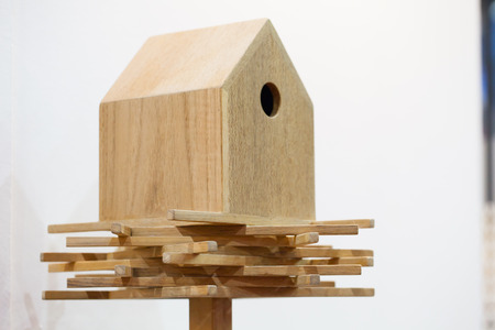 Wooden bird house on a pole