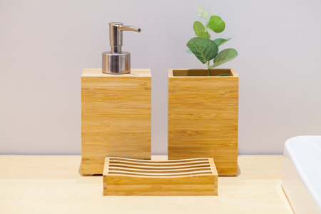 Wooden liquid soap bottle with small tree and soap pad . Bathroom Cosmetics. Bathroom accessories. Hygiene concept.の写真素材