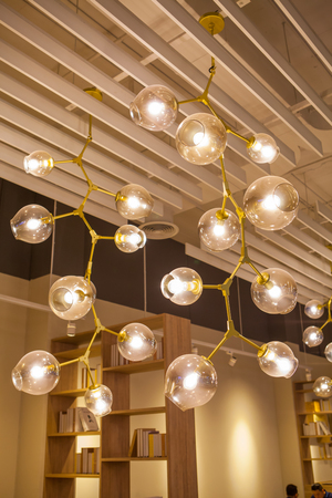 Beautiful chandelier. luxury expensive chandelier hanging under ceilingの写真素材