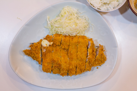Fried cutlet pork (Tonkatsu : Japanses foods) on white plate with cabbageの写真素材