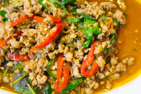 stir-fried with minced pork and basil on white plate (Ka Prao Moo)の写真素材