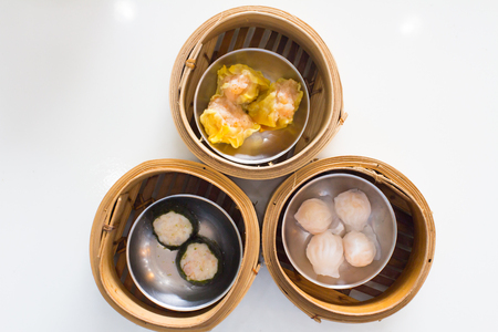 Top view fresh dumplings with hot steams on wood plate .Chinese foodの写真素材