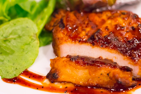 Grilled chicken steak on plate with baked potato and vegetable,Traditional cuisine. Grill kitchen.の写真素材