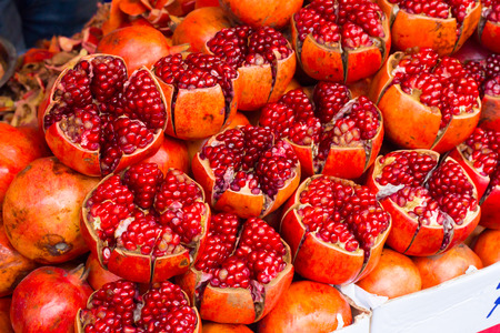 Pomegranate fruit / Ruby red, delicious and nutrient rich pomegranates pack a mighty punch in safeguarding your health. Pomegranate contains a unique and powerful antioxidantの写真素材