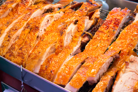Close up Thai roasted crispy pork on banana leafの写真素材