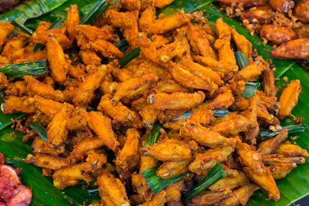 Deep Fried chicken wings. Buffalo chicken wings. Spicy food and thai herb.  Thai street foodの写真素材