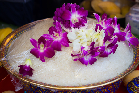Cooked rice in bowl  and orchid . Thai ancient styleの写真素材