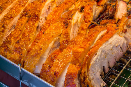 Close up Thai roasted crispy pork on banana leafの写真素材