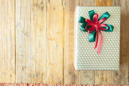 Christmas gift box on wooden background. Merry Christmas and Happy New Year!! Top view.の写真素材
